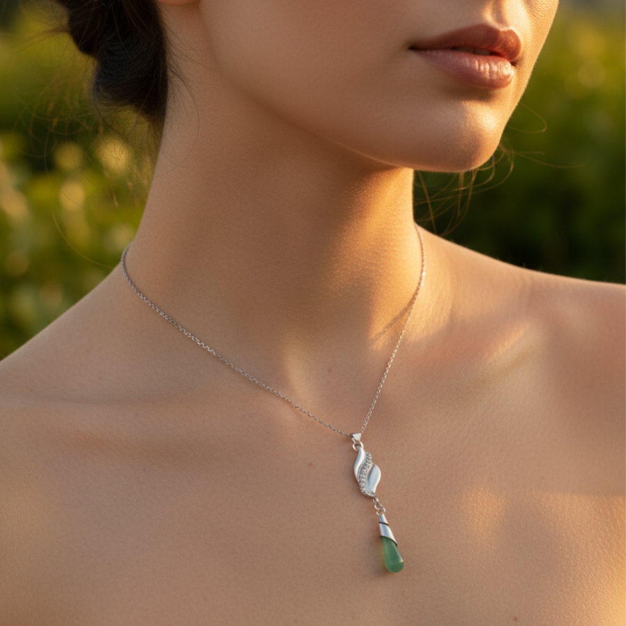 Lifestyle shoot of the Elara's Tear necklace during golden hour outdoors.
