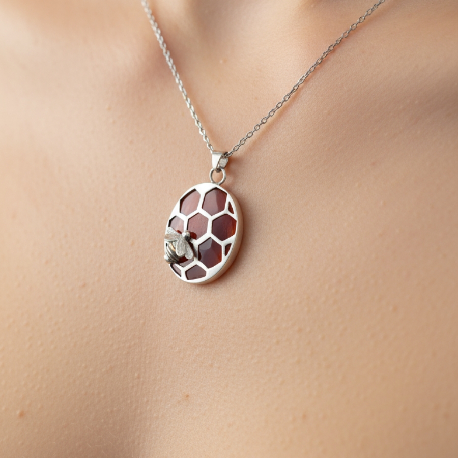 Close-up shoot of the Heart of the Hive necklace.